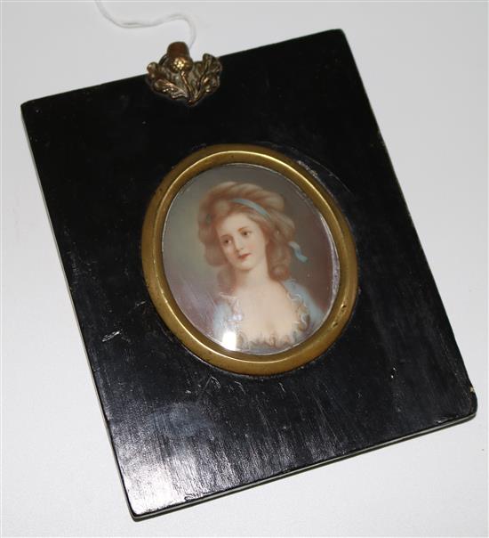 A portrait miniature on ivory of a lady wearing a lace trimmed blue gown, c